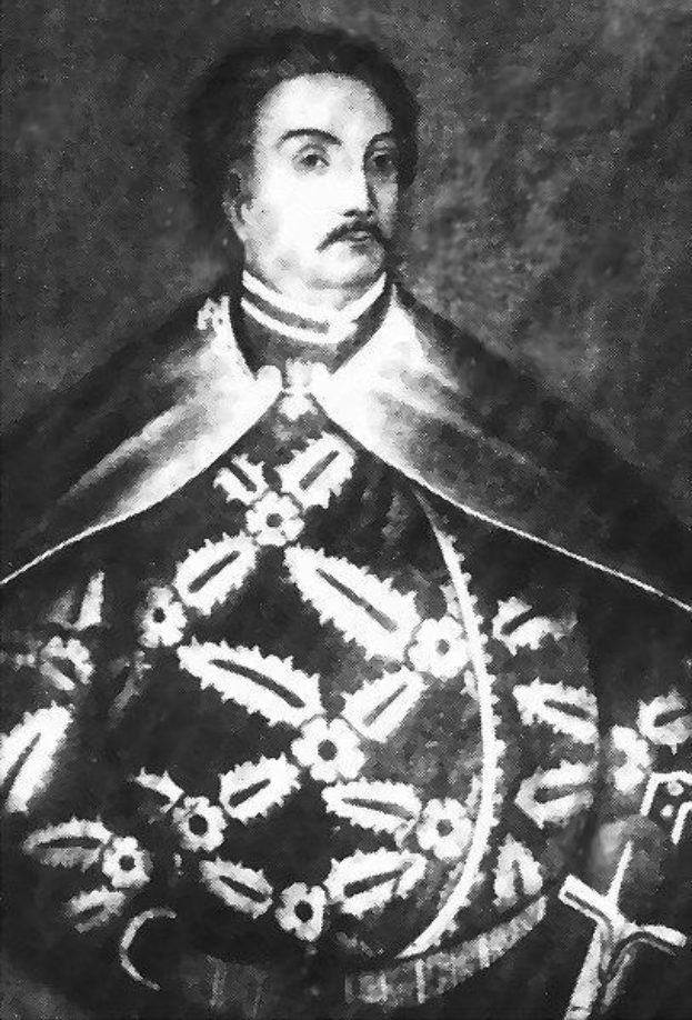 Schwarzes und weißes Foto von Papst Johannes Paul II. in Priesterrobe, der eine schwarze Robe mit weißem Kragen und Manschetten trägt, die Hände gefaltet, strenger Gesichtsausdruck und direkter Blick.