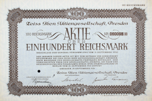 Altes deutsches Aktienzertifikat über Einhundert Reichmark mit schwarzem Rand und gedrucktem Text.