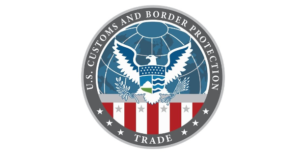 Logo der U.S. Zoll- und Grenzschutzbehörde Handel: ein blauer Kreis mit einem weißen Stern, einer weißen Taube mit ausgebreiteten Flügeln und dem Text "U.S." darüber.